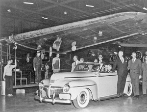 FDR in car passing under B-17F wing